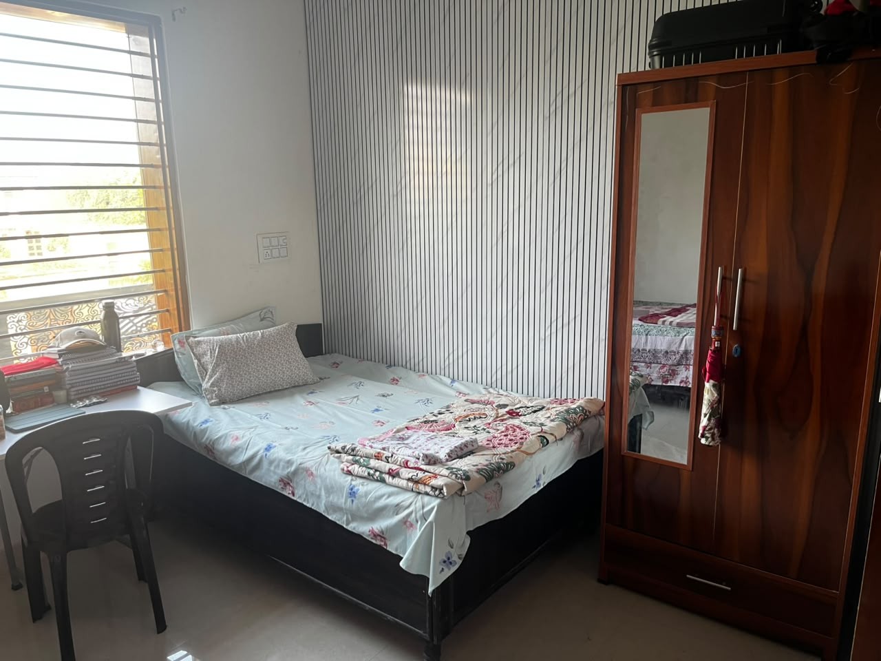 Room with wardrobe and study area